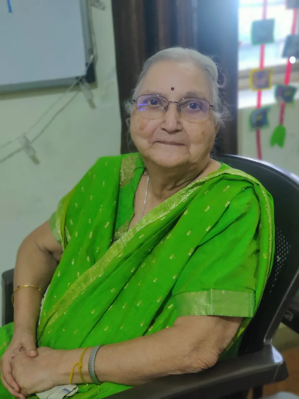 Happy elderly woman at Rainbow Day Care